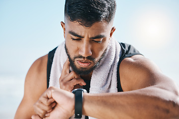 Image showing Man, fitness and watch for pulse, heart rate or performance on break after workout, running or training. Fit, active and sporty male person checking wristwatch for monitoring body exercise in nature