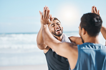 Image showing High five, fitness success and people at beach in celebration, winning and workout goals or target. Training, exercise and sports men, personal trainer or athlete friends, hands together and support