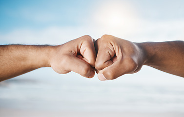 Image showing Man, hands and fist bump for partnership, unity or collaboration in deal or agreement outdoors. Hand of men or friends bumping fists for community, mission or goals together in solidarity or success