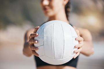 Image showing Woman, hands and volleyball in fitness for sports, game or match on beach in training or practice in nature. Hand of active and sporty female person holding ball for playing volley on ocean coast