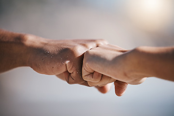 Image showing Man, hands and fist bump for teamwork, partnership or unity in solidarity or community in the outdoors. Hand of friends bumping fists together for team goals, support or motivation in collaboration