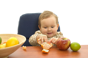 Image showing Babby eating fruit