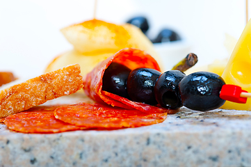 Image showing mix cold cut on a stone with fresh pears