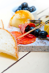 Image showing mix cold cut on a stone with fresh pears