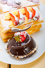 Image showing selection of fresh cream cake dessert plate