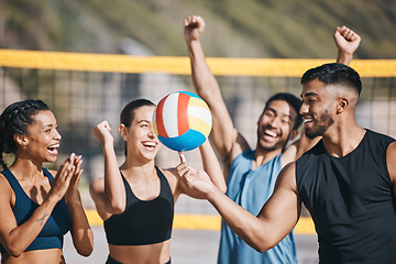 Image showing People, volleyball and team celebration on beach for winning, victory or sports achievement in nature. Happy group of athletes or friends with ball for volley championship or success on ocean coast