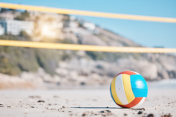 Image showing Volleyball, beach sand and net with sports and fitness, outdoor and playing game with nature and summer. Exercise, match with ball closeup and active, workout and tournament with competition