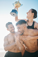 Image showing Celebration, winning and volleyball team on the beach with a trophy for goals, success or achievement. Happy, celebrate and group of athletes in unity together by ocean or sea on summer weekend trip.