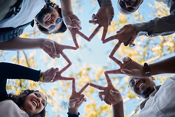 Image showing Creative people, hands and star with fingers in teamwork, solidarity or collaboration in nature. Low angle of team group touching hand together for faith, support or community, hope or startup goals