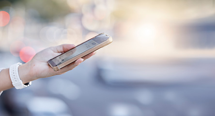 Image showing Woman, hands and phone in the city for communication, networking or social media in street. Hand of female person in road on mobile smartphone for online browsing, texting or chatting in a urban town