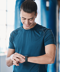 Image showing Man, fitness and smart watch with app to check, measure or time exercise for tracking health on technology. Sports, athlete and happy with workout, training and cardio wellness in gym facility