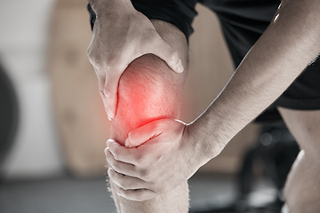 Image showing Hand, knee pain and injury with the leg of a man in red highlight during a fitness workout. Healthcare, medical and anatomy with a male athlete holding a joint after an emergency in the gym closeup