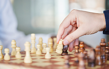 Image showing Playing, board game and chess checkmate with a man at a table while moving piece for strategy or challenge. Hands of a male person to play, relax and bond while moving icon for problem solving or win