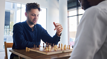 Image showing Board game, chess and men playing at a table while talking strategy or plan. Business partners or friends together to play, relax and bond with wooden icon for problem solving, challenge or checkmate