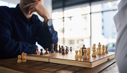 Image showing Board game, chess and men playing at a table in office while thinking of strategy or plan. Male friends together to play, relax and bond with wooden icon for problem solving, competition or checkmate