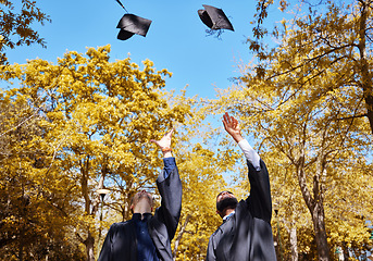 Image showing Graduation cap, students or friends and throw in air or sky for celebration, study success and achievement on campus. University people or graduate with college, school and education or scholarship