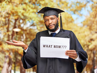 Image showing Paper sign, graduation and portrait of a man in a garden by his college campus with a confused gesture. Doubt, graduate and African male student with poster and shrug expression outdoor at university