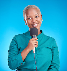 Image showing Reporter woman, smile and microphone in studio portrait for news, announcement or talk show by blue background. Young African journalist, holding mic and happy tv host for speech, press or interview