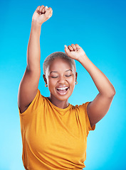 Image showing Winner, dance and happy woman on studio, blue background for excited celebration, energy and success. Winning, yes and young, african person dancing with wow, fist and power, goals or cheers in music
