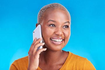 Image showing Phone call communication, face and happy black woman speaking in conversation, consulting or chat discussion. Cellphone user, studio smile and talking African person listening on blue background