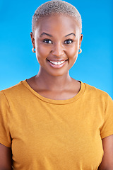 Image showing Black woman, smile and happy portrait in studio with a positive mindset, happiness and beauty. Face of an African female model on a blue background for motivation, confidence and natural cosmetics