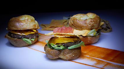 Image showing Mexican quesadilla with chicken, cheese and peppers on wooden table