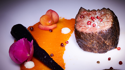 Image showing The grilled beef steaks with spices and salt.