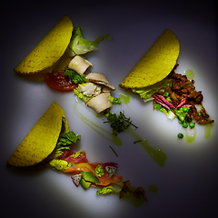 Image showing Three different tacos with beef, chicken and salmon. View from above. With copy space.