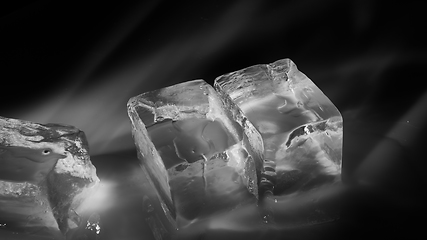 Image showing Pieces of crushed ice cubes on black background.