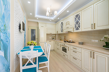 Image showing Beige, white and cyan furniture at kitchen in provence style,