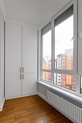 Image showing Empty heated penthouse living room with floor to ceiling windows