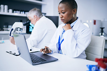 Image showing Laptop, science and woman in a laboratory for research, internet or medical results. Serious person and a man scientist or doctor team with tech for scientific innovation, planning or data report