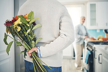 Image showing Senior, couple and flowers for love in home, kitchen or husband with bouquet of roses to surprise woman in happy marriage. Man, wife and back hiding gift, flower and romance together on anniversary