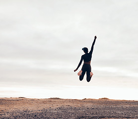 Image showing Wellness, fitness goals and woman jump in nature for achievement, success and celebrate workout Sports, mockup space and happy female person with hands in air for exercise, training or running target