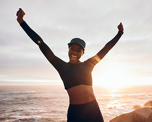 Image showing Portrait of woman celebrate by ocean for fitness in nature for exercise, marathon training and running goals. Sports, sunset and female person with hands in air for winning, workout and wellness