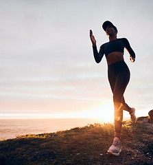 Image showing Running, sunrise and woman on mountain by ocean for exercise, marathon training and fitness. Sports, mockup space and female person in nature for warm up, cardio workout and body wellness in morning