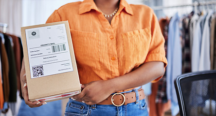 Image showing Hands, designer or woman with box for delivery, shipping or package with logistics in ecommerce in office. Closeup, fashion or business owner with clothes stock or store order for courier service