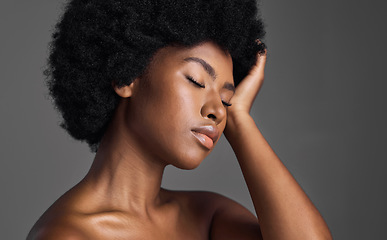 Image showing Natural beauty, hair care and black woman with skincare, dermatology and confident girl on a grey studio background. Female person, luxury or model with makeup, cosmetics and aesthetics with grooming