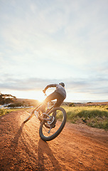 Image showing Sports, morning and man of bicycle in nature for training, workout and exercise in countryside. Fitness, cycling and male person with mountain bike for adventure, freedom and adrenaline on dirt road