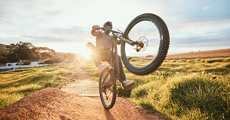 Image showing Sports, adrenaline and man of bicycle in nature for training, workout and exercise in countryside. Fitness, cycling and male person with mountain bike for adventure, freedom and speed on dirt road