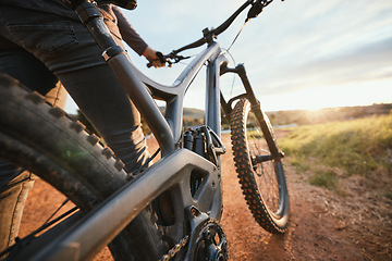 Image showing Sports, mountain bike and closeup of bicycle in nature for hobby, workout and exercise in countryside. Fitness, cyclist and person cycling for adventure, freedom and adrenaline on outdoor dirt road