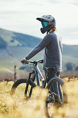 Image showing Sports, cycling and man with helmet on bicycle in nature for training, workout and exercise in countryside. Fitness, cyclist and person with mountain bike for adventure, freedom and ride on dirt road