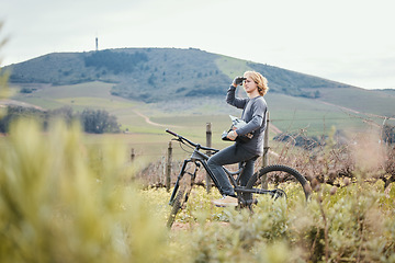 Image showing Fitness, cycling and man on bicycle in nature for training, workout and exercise in countryside. Sports, cycling and male person with mountain bike for adventure, freedom and adrenaline on dirt road