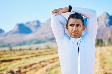 Image showing Cyclist man, stretching arms or thinking of race, fitness or travel in nature for wellness by mountains. Warm up, countryside or healthy sports athlete ready to start training with active workout