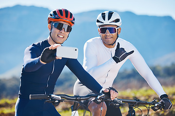 Image showing Fitness, bike and selfie with friends in nature for cycling, taking a break from a cardio or endurance workout. Exercise, mountain and man cyclist team taking a picture together while sports training