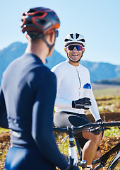 Image showing Fitness, bike and friends drinking water in nature, taking a break from their cardio or endurance workout. Exercise, mountain and a man cyclist team in conversation while cycling in the countryside