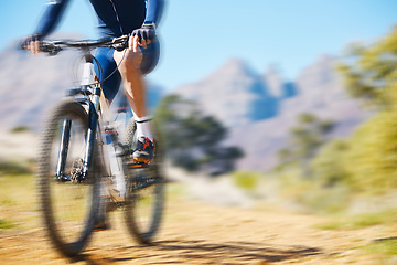 Image showing Cycling, fitness and man on a bike in nature for extreme sports, race or training with motion blur. Bicycle, exercise and male cyclist riding on a dirt road with energy, adrenaline or speed challenge