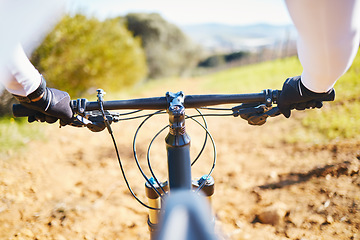Image showing Cycling, fitness and bike with hands of person in nature for training, sports or travel. Workout, exercise and wellness with closeup of cyclist and handlebar of bicycle on path for energy and freedom