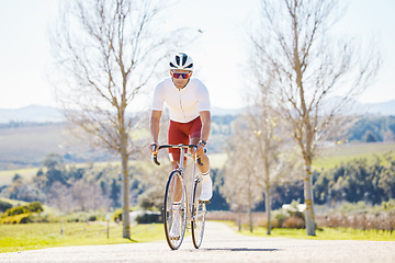 Image showing Fitness, countryside or man cycling on a bicycle for training, cardio workout and exercise outdoors alone. Wellness, healthy or sports athlete riding a bike on a road or path for freedom or challenge