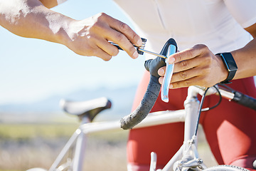 Image showing Fixing, bicycle and a man outdoor with handlebar, gear or brake problem while cycling. Bike, hands and a sports person or athlete for maintenance, safety or repair tools on broken transportation